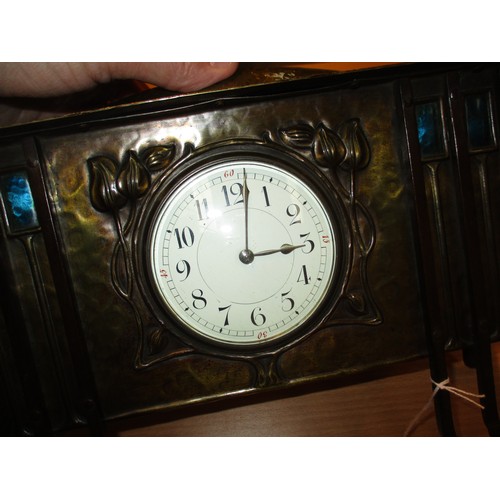 244 - Arts & Crafts Embossed and Planished Brass Mantel Clock having Blue Enamelled Panels, 33.5cm wide, 2... 