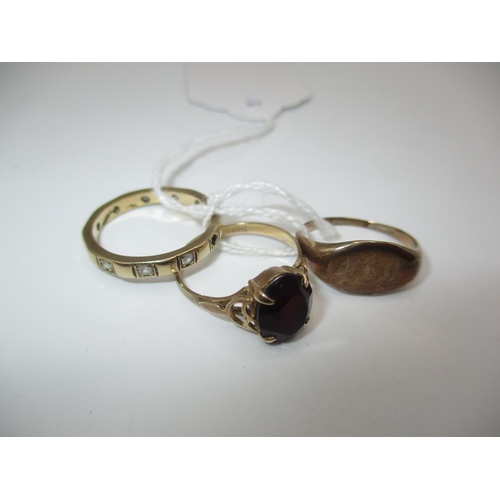 323 - 9ct Gold Red Stone Ring and Eternity Ring, along with a Gents Ring, 7.69g total