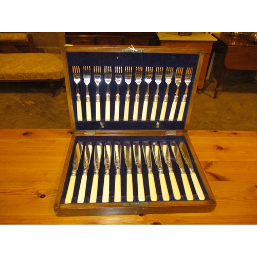 119 - Oak Cased Set of 12 Pairs of Fish Knives and Forks