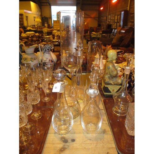 85 - Two Tall Glass Vases, 4 Decanters and a Wine Jug