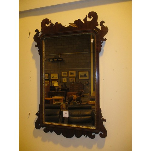 697 - Mahogany and Parcel Gilt Fretwork Carved wall Mirror, parts of broken crest with staff