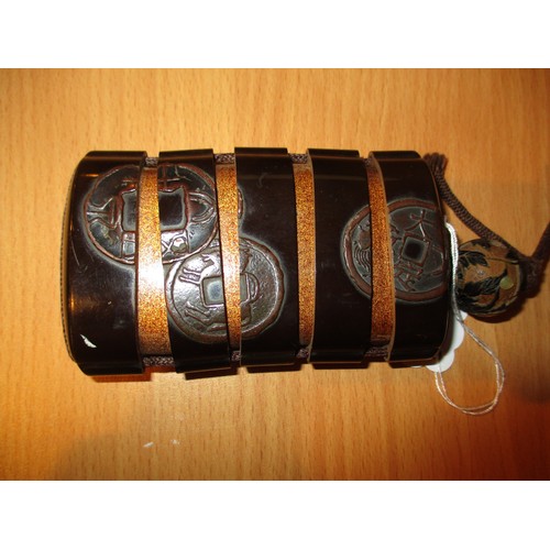 329 - Two Japanese Lacquer 5 Section Inros, one with an Ojime