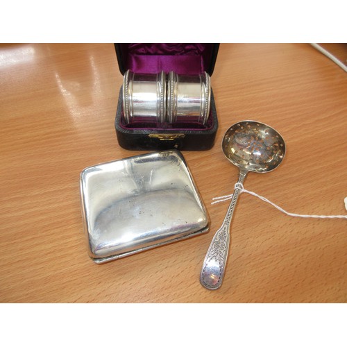 431 - Silver to Include a Pair of Napkin Rings, Cigarette Case and a Silver Sifter Spoon, 134g