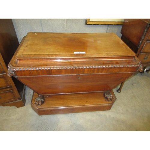 738 - 19th Century Mahogany Sarcophagus Cellarette on Lion Paw Feet having a Lead Lined Interior, with key...
