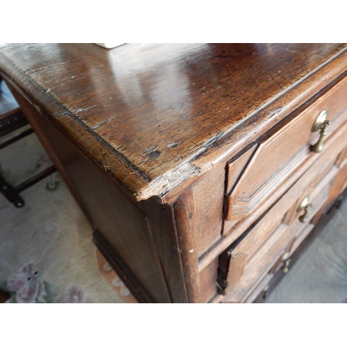 103 - A Jacobean oak straight front chest fitted two narrow and three wide drawers with moulded decoration... 