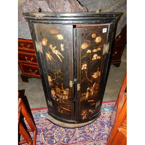 117 - A Georgian bow front corner cabinet with black Chinoiserie lacquered decoration of figures - 22in. w... 