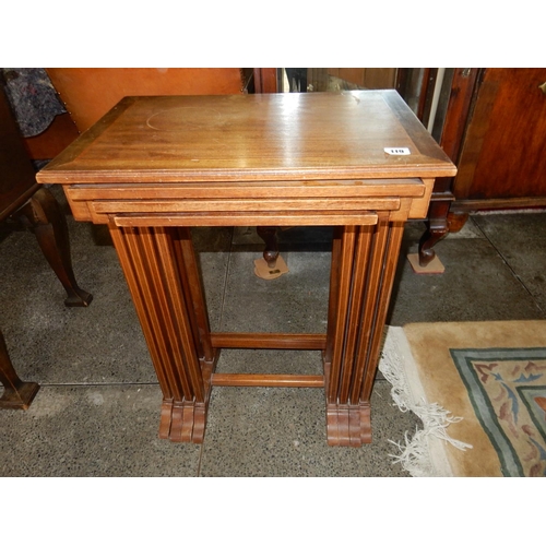 119 - A nest of four mahogany and inlaid occasional tables with rectangular tops, on twin square end suppo... 