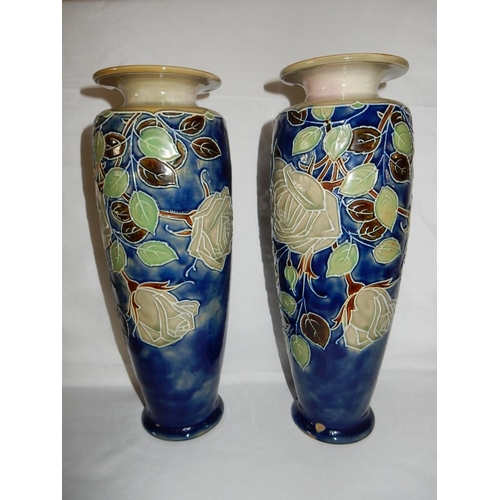 123 - A pair of Royal Doulton vases, blue ground with tube lined decoration of roses and leaves - 14 1/4in... 