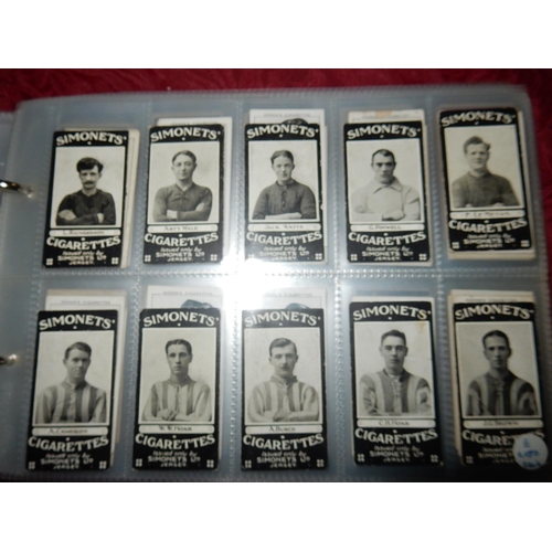 24 - An album of cigarette cards including Ogdens Football Club Colours, Simonets Ltd Local Footballers, ... 