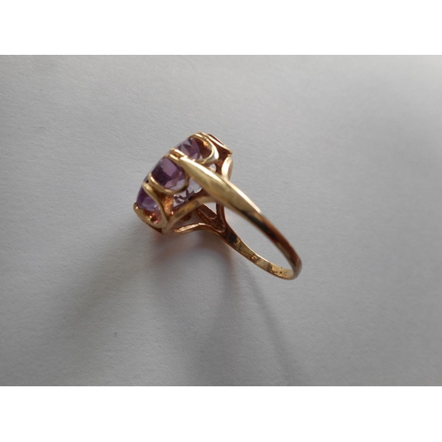 241 - A lady's ring set amethyst, on a 9ct. gold shank