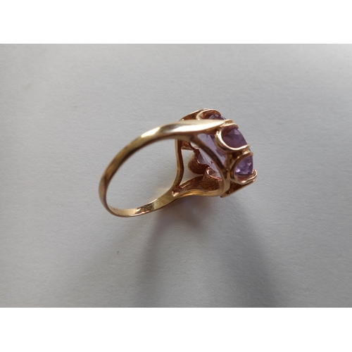 241 - A lady's ring set amethyst, on a 9ct. gold shank