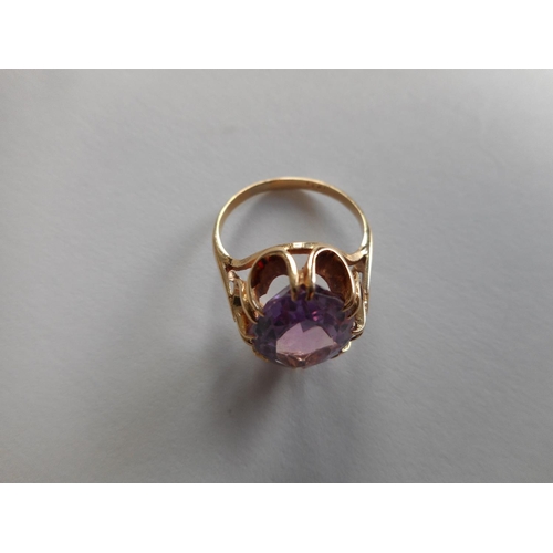 241 - A lady's ring set amethyst, on a 9ct. gold shank