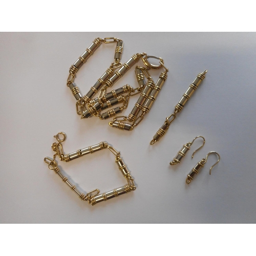 246 - An 18ct. two colour gold necklace with two spare links, a matching bracelet and a pair of earrings