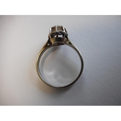 249 - A lady's solitaire diamond ring, on a white gold coloured metal shank