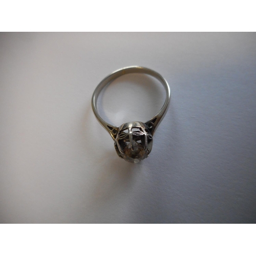 249 - A lady's solitaire diamond ring, on a white gold coloured metal shank