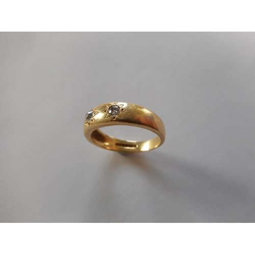 261 - An 18ct. gold ring set three diamonds