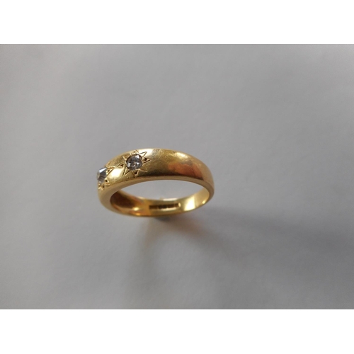 261 - An 18ct. gold ring set three diamonds