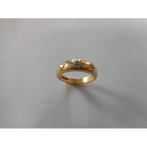 261 - An 18ct. gold ring set three diamonds