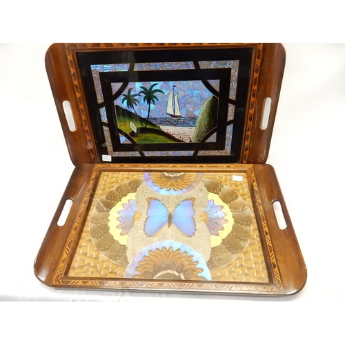 263 - Four walnut and inlaid trays, the centres decorated with butterfly wings and two similar smaller pic... 