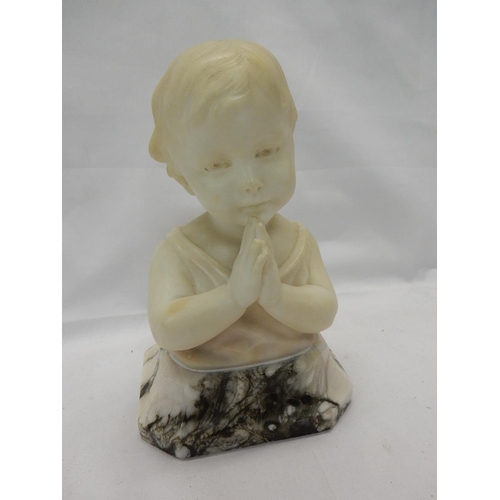 276 - An alabaster bust of a young child praying, on marble base, signed to the back R Kuchler - 8 1/2in. ... 