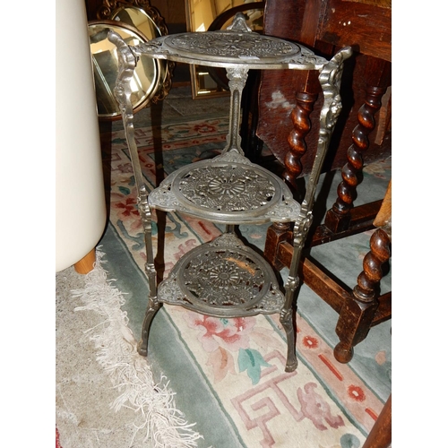 54 - A Victorian mahogany framed swing toilet mirror with turned supports, on shaped base and an iron thr... 