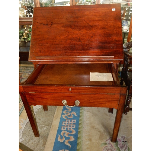 89 - A 19th Century mahogany architects table with adjustable hinged folding top, fitted drawer with slid... 