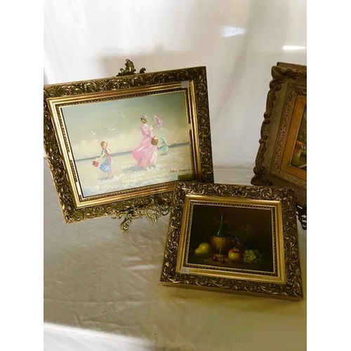 12 - A pair of oils on panel - Paris street scenes, gilt framed, a beach scene by Marie Charlot and a sti... 