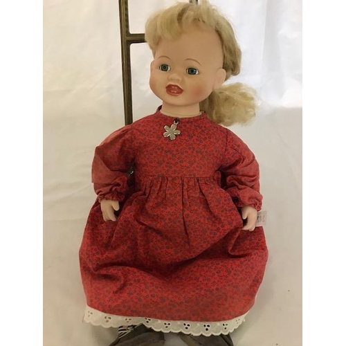 242 - A modern bisque headed doll marked no.9422B to the head, dressed