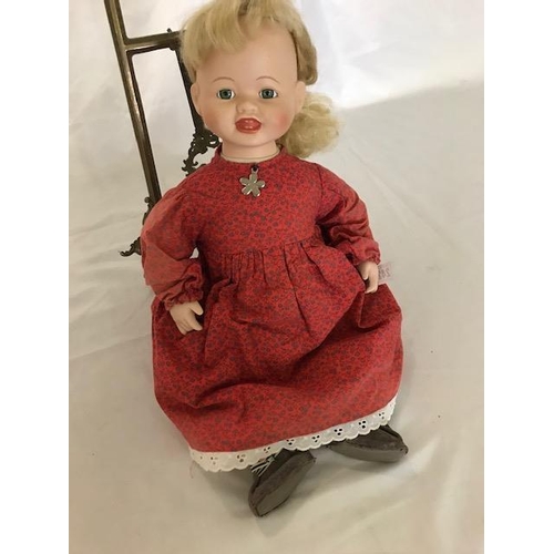 242 - A modern bisque headed doll marked no.9422B to the head, dressed