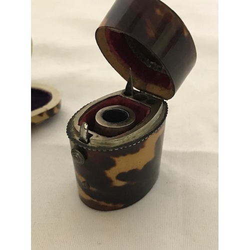 244 - A 19th Century tortoiseshell mounted travelling inkwell fitted a bottle and one pen nib and a tortoi... 