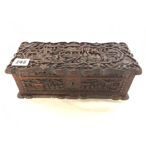 245 - A 19th Century Cantonese cedar wood box with all over carved decoration of figures in garden scenes ... 