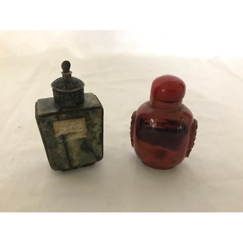 246 - An antique Chinese jade snuff bottle of square section with silver coloured metal mounts and one oth... 