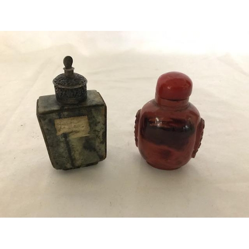 246 - An antique Chinese jade snuff bottle of square section with silver coloured metal mounts and one oth... 