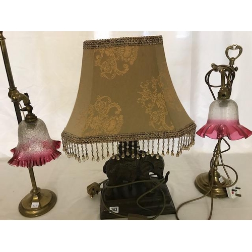 263 - A Victorian brass tablelamp with adjustable cranberry shade, one other brass lamp with Victorian cra... 