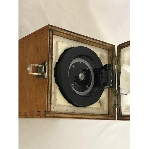 268 - A compass in fitted wooden box and a copper car foot warmer