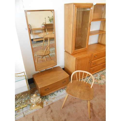 38 - An Ercol Windsor light elm cheval mirror, the base fitted drawer - 26in. wide and an Ercol elm low s... 