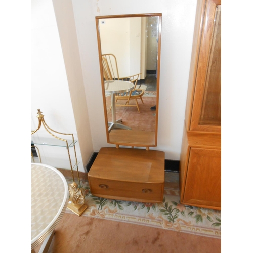 38 - An Ercol Windsor light elm cheval mirror, the base fitted drawer - 26in. wide and an Ercol elm low s... 