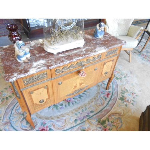 49 - A Continental kingwood commode with floral marquetry inlaid decoration, rouge marble top, the front ... 