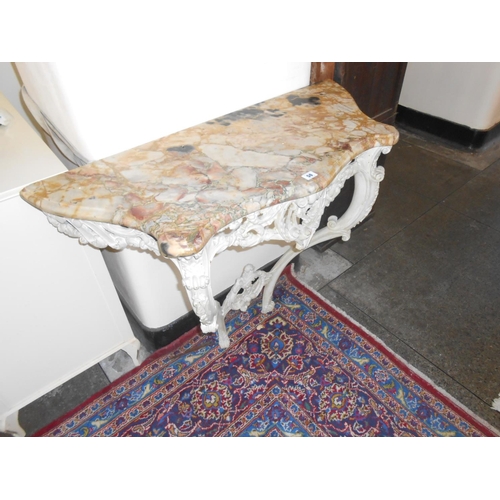 50 - A cream painted pine Rococo style console table with marble top, on scrolling base - 38in. wide