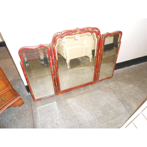 51 - A triple folding dressing table mirror in a Chinoiserie style red lacquered frame, a rectangular str... 