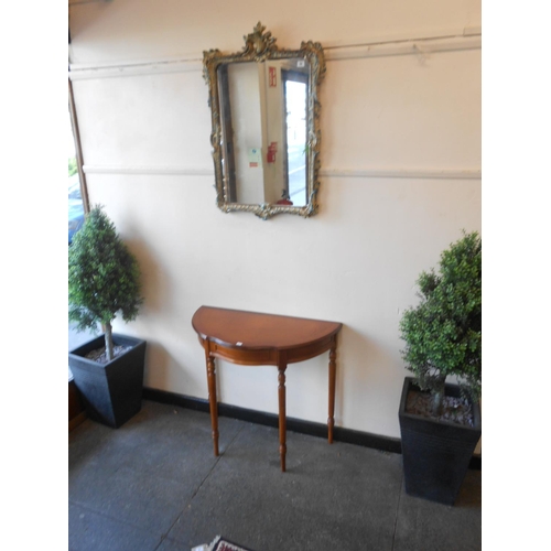 52 - A rectangular wall mirror in a cream and blue painted scrolling frame and a reproduction yewwood con... 