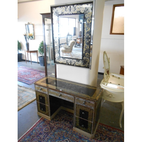 55 - A faux tortoiseshell and mirrored dressing table fitted seven drawers, on platform base - 48in. wide... 