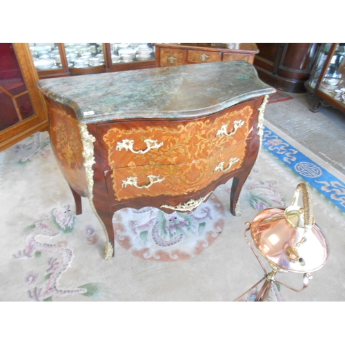 57 - A Continental kingwood commode of bombe form with floral marquetry decoration, marble top, fitted tw... 