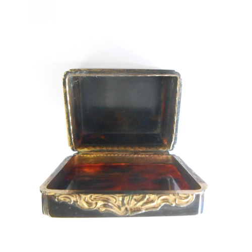 255 - A Georgian tortoiseshell snuff box, the lid inset gold and diamonds to floral design - 2 1/4in. dia.... 