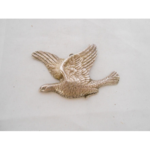 203 - A 19th Century silver label in the form of a grouse in flight - London 1823, makers marks TH