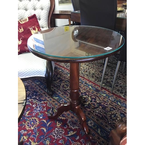 43 - A 19th Century mahogany occasional table with circular top, on turned column, three scrolling downsw... 