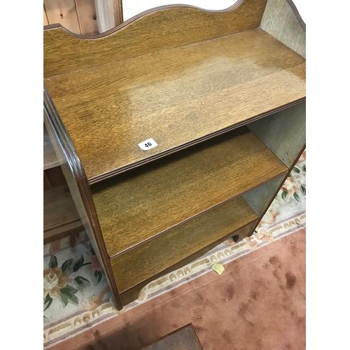 46 - An oak openfront bookcase with 3/4 tray top, fitted adjustable shelves, on bracket feet - 27in. wide