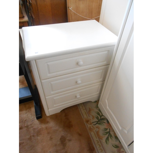 122 - A modern white melamine small wardrobe fitted door and five drawers - 40in. wide and a matching ches... 