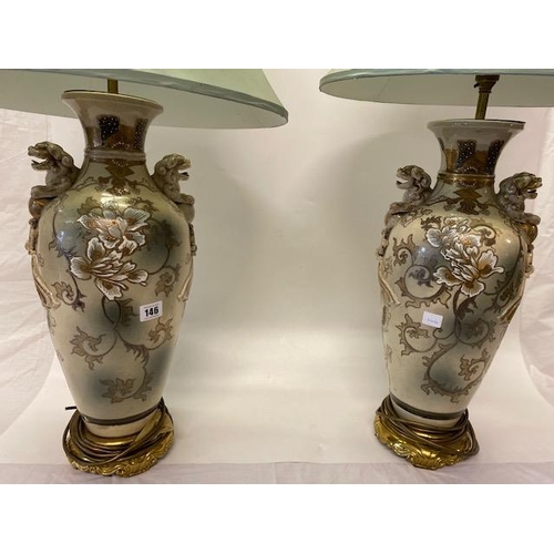 146 - A pair of Japanese Satsuma vases with Dog of Fo handles, decorated all round with Geisha girls, gilt... 