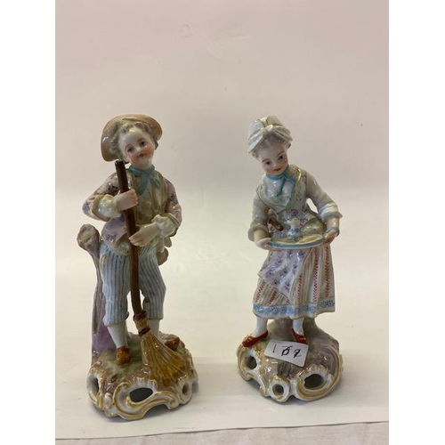 169 - A pair of Continental porcelain figures, male and female, she with a tray and duster and he with a b... 